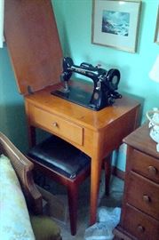 Antique Singer sewing machine and bench.