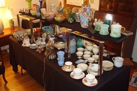 Antique and collectibles including Acoma pottery, Roseville, Weller, Belleek, and other items.