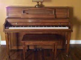 Baldwin upright piano and bench.