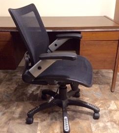 Ergonomic office chair. Can appear to be "armless" when the arms are adjusted up.
