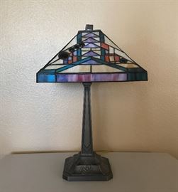 Stained glass lamp is 14w by 21h