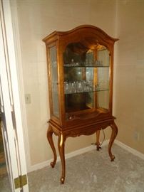 gold curio, lighted