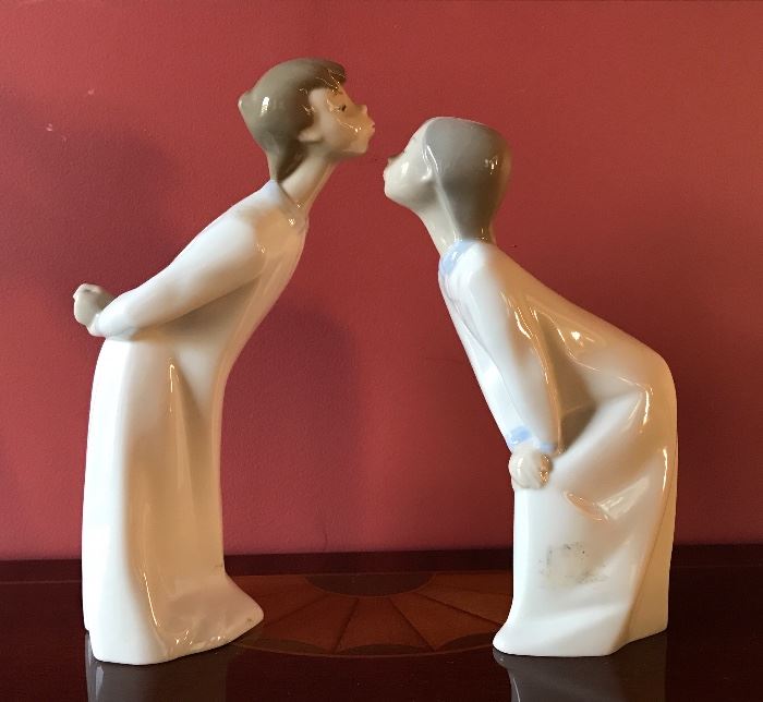 Lladro “Girl blowing kiss” and “Boy blowing kiss” figurines #4873, #4869 