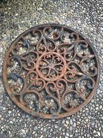 Just a cool picture, huh? Metal grate against pebbles