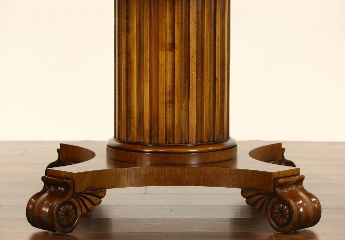 Fluted column pedestal and scrolled feet have classical motifs. 
