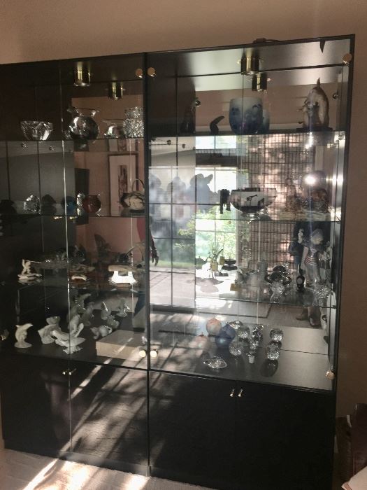 Vintage black display cabinet with collectibles 