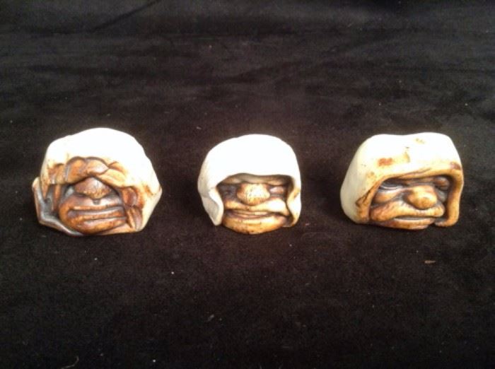 Small ceramic face figurines