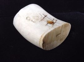 Early carved bone implement. May have been a knife hilt