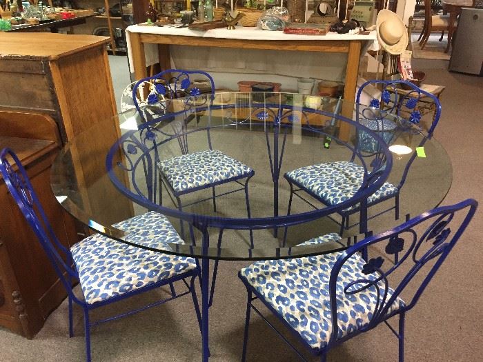 Vintage wrought iron outdoor table with four chairs and new outdoor fabric on seats