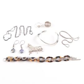 Sterling Silver Jewelry Including Cubic Zirconia: An assortment of sterling silver jewelry. This selection contains necklaces, bracelets, rings, a pair of earrings, and a figural horse brooch; some of which feature cubic zirconia and dyed irradiated freshwater pearl. These items are hallmarked or tested as sterling. The total weight, inclusive of all materials, is 2.585 ozt.