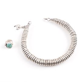 Sterling Silver Necklace and Ring: A sterling silver necklace and ring. This selection contains a sterling spring style necklace and a ring with turquoise cabochons. They are hallmarked or tested as sterling. The total weight, inclusive of all materials, is 5.105 ozt.