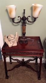 Side table matching the Bedroom Suite that features same ornate style.