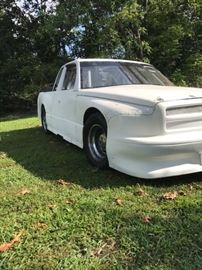 Right Front view of this Asphalt Oval Track Racing Truck. Start the engine, listen to the the motor, this beauty is geared up ready to hit the tracks.