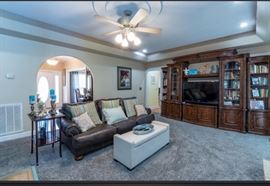 Another view of living room giving a closer look at the extraordinary versatile 7- section media center. Put it all together as featured or divide the curio cabinets and place in other areas through your home. Beautiful pieces!
