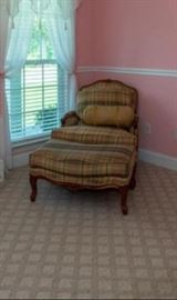 Solid wood antique oversized chair with cushion and ottoman. Very comfortable.