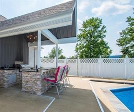 Available for sale in this picture are the 4 aluminum outdoor kitchen stools. Like New!