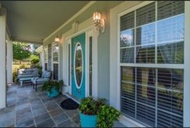 Front porch furniture, Love Seat, two matching chairs, two teal flower pots with plants included, and a door mat. Ready to put on your front porch!