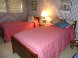 pair twin beds w/wooden headboards