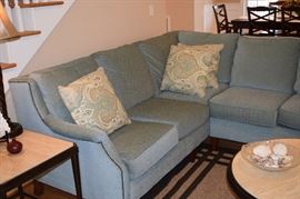 Flexsteel 2 Piece Sectional Heavy Duty I think Color is Tea Green. Clean, Great Condition. Back Cushions Attached, Seat Cushions Loose. Section 1: 6' X 34" Deep X 36" Tall. Section 2: 7' X 34" Deep X 36" Tall. Fabric is a blend of Acrylic, Nylon, Polyester and Cotton