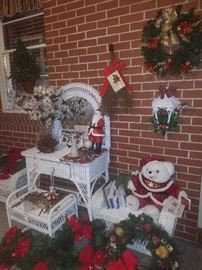 White wicker vanity & bench, other white wicker benches, & Christmas décor. 
