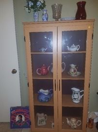Two door curio cabinet, pitchers/tea pots, and more.