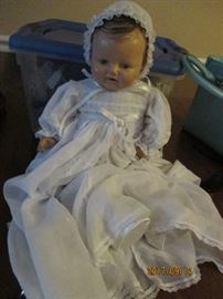 Antique doll in christening dress