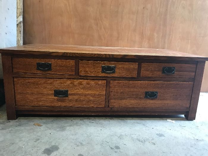 Heavy solid oak mission-style coffee table with drawers on both ends. 