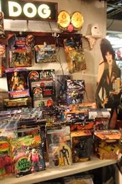 Lots of toys and action figures, including Simpsons, Futurama, The Tick, Pee Wee Herman, Aliens, Predator, Spawn, Terminator, Toy Story, etc.