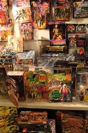 Lots of toys and action figures, including Simpsons, Futurama, The Tick, Pee Wee Herman, Aliens, Predator, Spawn, Terminator, Toy Story, etc.
