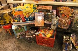 Lots of toys and action figures, including Simpsons, Futurama, The Tick, Pee Wee Herman, Aliens, Predator, Spawn, Terminator, Toy Story, etc.