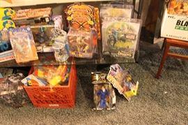 Lots of toys and action figures, including Simpsons, Futurama, The Tick, Pee Wee Herman, Aliens, Predator, Spawn, Terminator, Toy Story, etc.