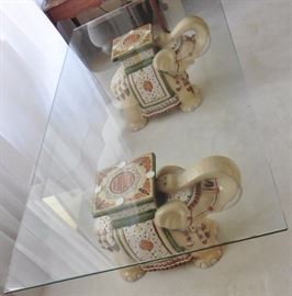 Pair of elephants with glass table top
