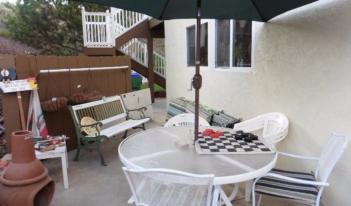 Patio table, chairs, umbrella more