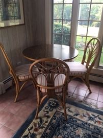 RATTAN chairs, cushioned, with round wooden table