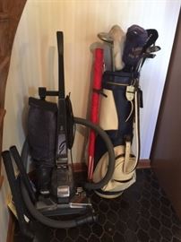 KIRBY vacuum; golf clubs and bag
