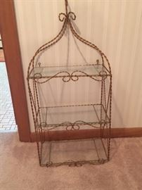 Brushed goldtone wall shelf with glass