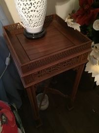 One of 2 Asian side tables with carved gallery