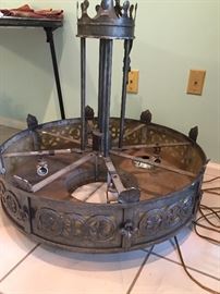 Mid century chandelier with crown on top, iron cross and unique design.  Curved glass inside to reflect light