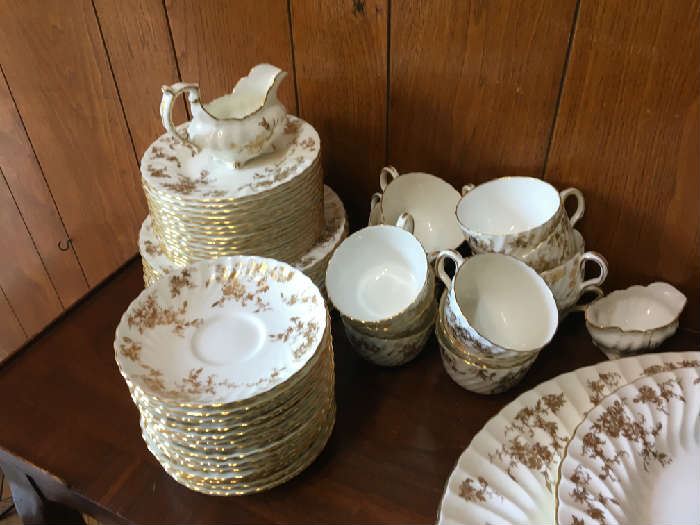 Gold Ancestral Minton, Includes Large Meat platter, Large round serving dish, Service for 12 Dinner plates, Salad plates, Dessert plates, Cups and saucers Creamer and Sugar