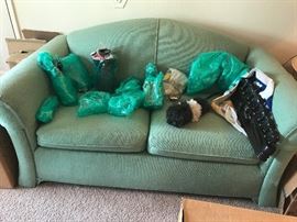 Green curved loveseat