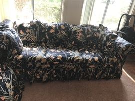 Black floral chintz sofa with pillows - glam 1980's