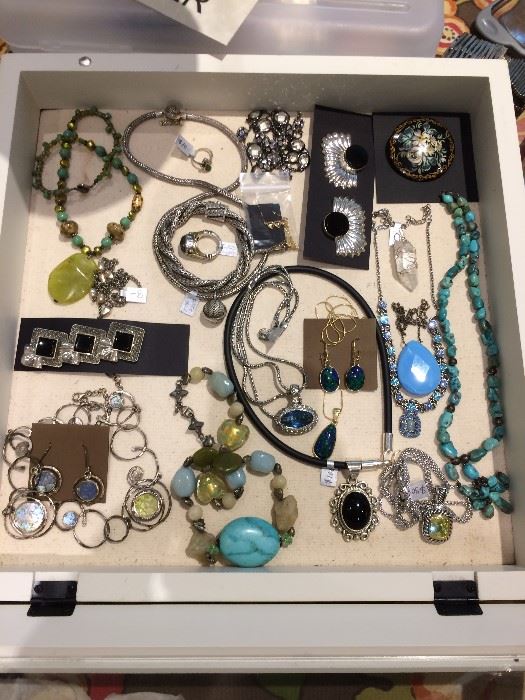 A variety of jewelry including artisan and designer pieces