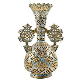 19th-Century Fischer J. Highly Reticulated Vase: A 19th-century Fischer J. reticulated ceramic vase, Budapest, Hungary. Hand painted with Persian blue and gilt decoration, having double hexagonal handles. Highly ornate reticulation appears throughout the body, handles, neck and even extends from foot to collar. Marked to the underside with a black stamp.