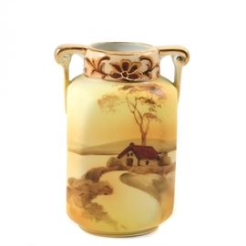 Hand Painted Art Deco Nippon Vase: A hand painted Art Deco Nippon vase illustrating a rural landscape on a gold background. The vase has a squared form with a high shoulder and gold handles at each side of a short neck. The vase is ink stamped appropriately to the bottom.