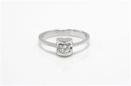 18K White Gold Diamond Heart Ring: A reverse tapered white gold shank with round cut diamond held in a heart shaped cage to the center.