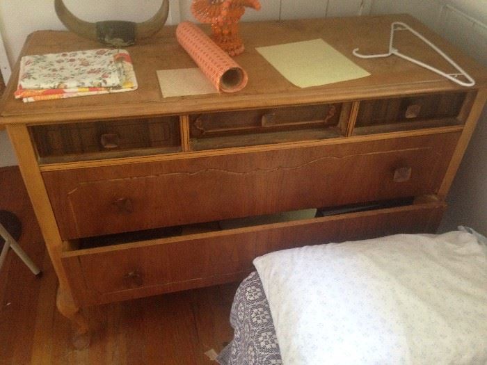 Antique dresser with variety of wood