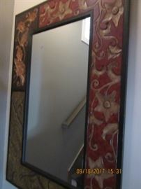 This 4' x  30" mirror is beautifully carved.