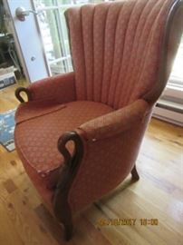 Side chair has swan arms. 
