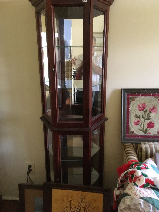 This is the same style Pulaski curio cabinet in walnut -- both are in excellent condition.