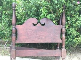 A nice four-poster bed with side rails with acorn finials